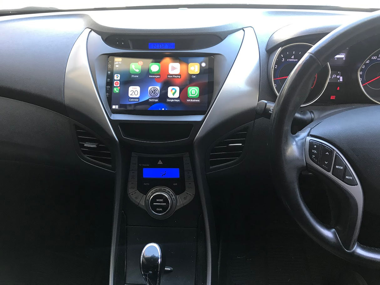 Car dashboard with an Extnix touchscreen display and steering wheel