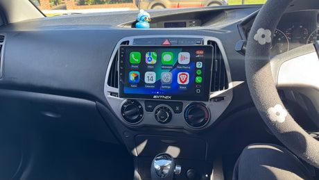 Hyundai i20 PB Car dashboard with an Extnix navigation system headunit installed and displaying  Wireless Apple Carpla app icons.